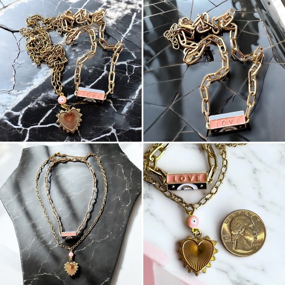 Gold toned chains with black, white, gold, and pastel pink enamel charms. - Picture 17 of 17